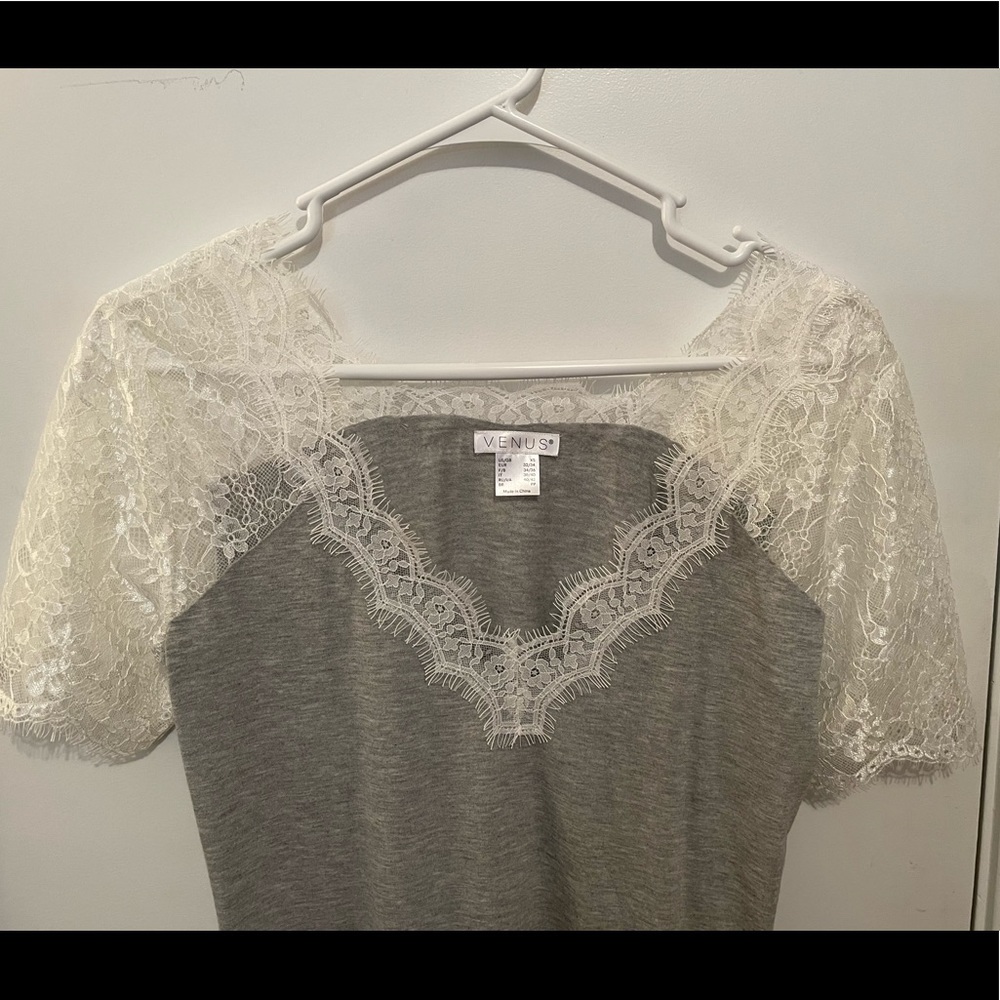 Venus Xs laced sleeved shirt. More of a small than XS. Never worn.
